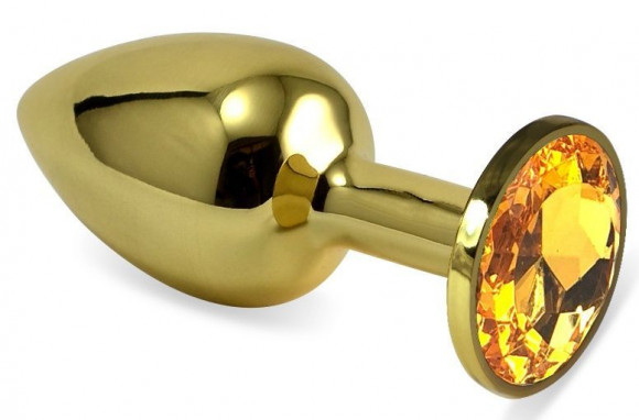 Золотистая анальная пробка с оранжевым кристаллом - 8,5 см. Золотистая анальная пробка с оранжевым кристаллом - 8,5 см.
