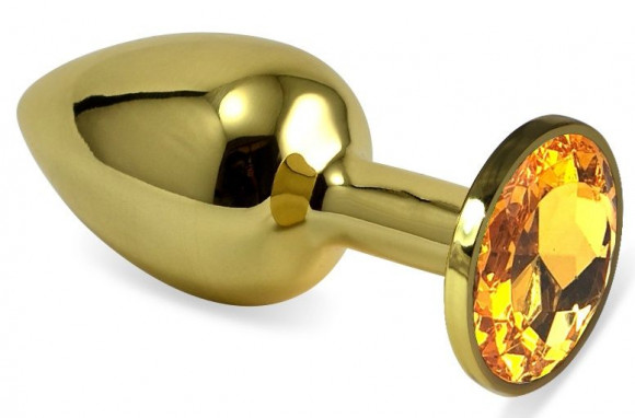 Золотистая анальная пробка с оранжевым кристаллом - 6,5 см. Золотистая анальная пробка с оранжевым кристаллом - 6,5 см.