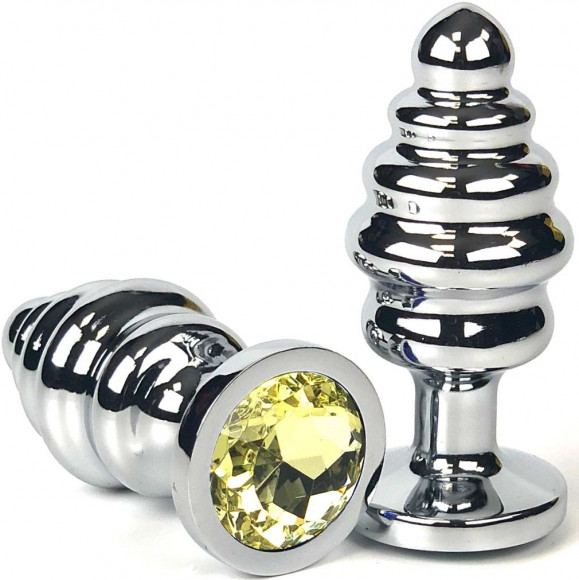 Серебристая ребристая анальная пробка с желтым кристаллом - 7 см.